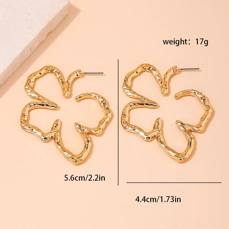 Stylish Vienna Verve Metal Earrings with Irregular Hollow Flower Design for Wholesale.