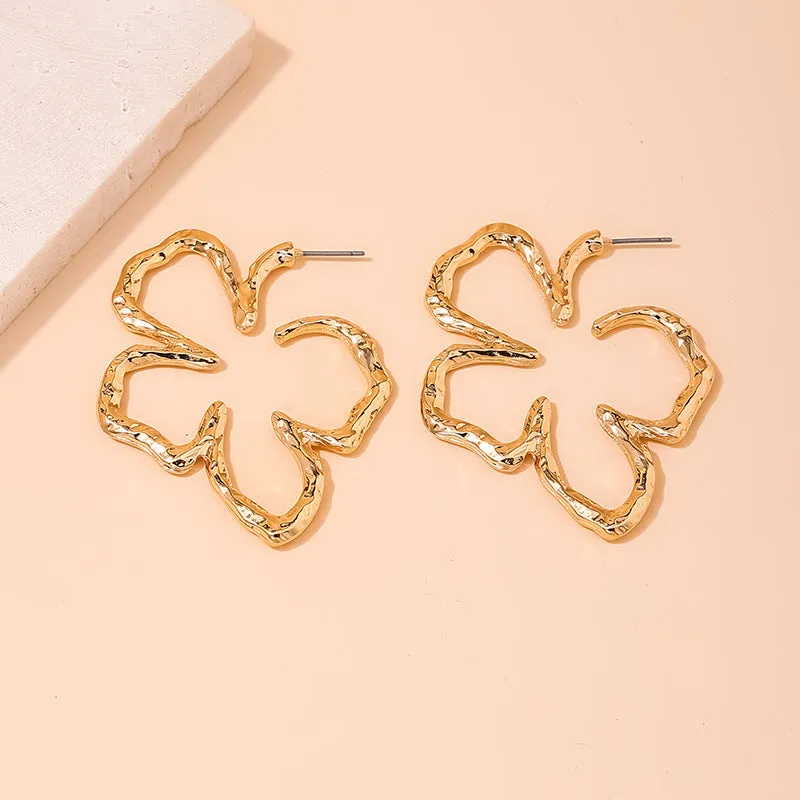 Stylish Vienna Verve Metal Earrings with Irregular Hollow Flower Design for Wholesale.