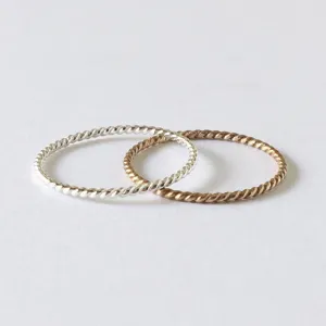 Twisted Stacking Rings